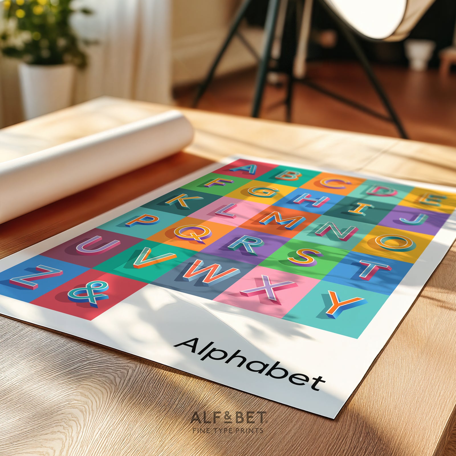 Angled view of an unframed Alphabet Print from Alf and Bet in a home office