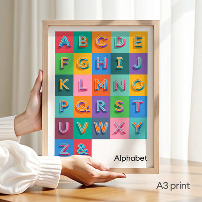 An A3 size Alphabet Print from Alf and Bet shown in a natural wooden frame