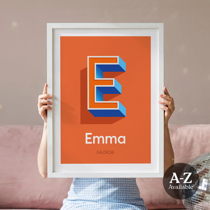 A personalised name and date print from Alf and Bet with a Brick Orange base colour and 3D letter with Orange infill and Deep Blue shadow.